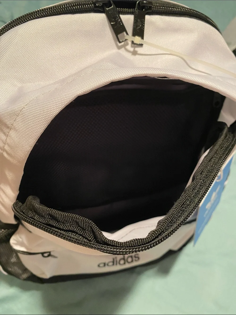 Classic black and white Adidas backpack